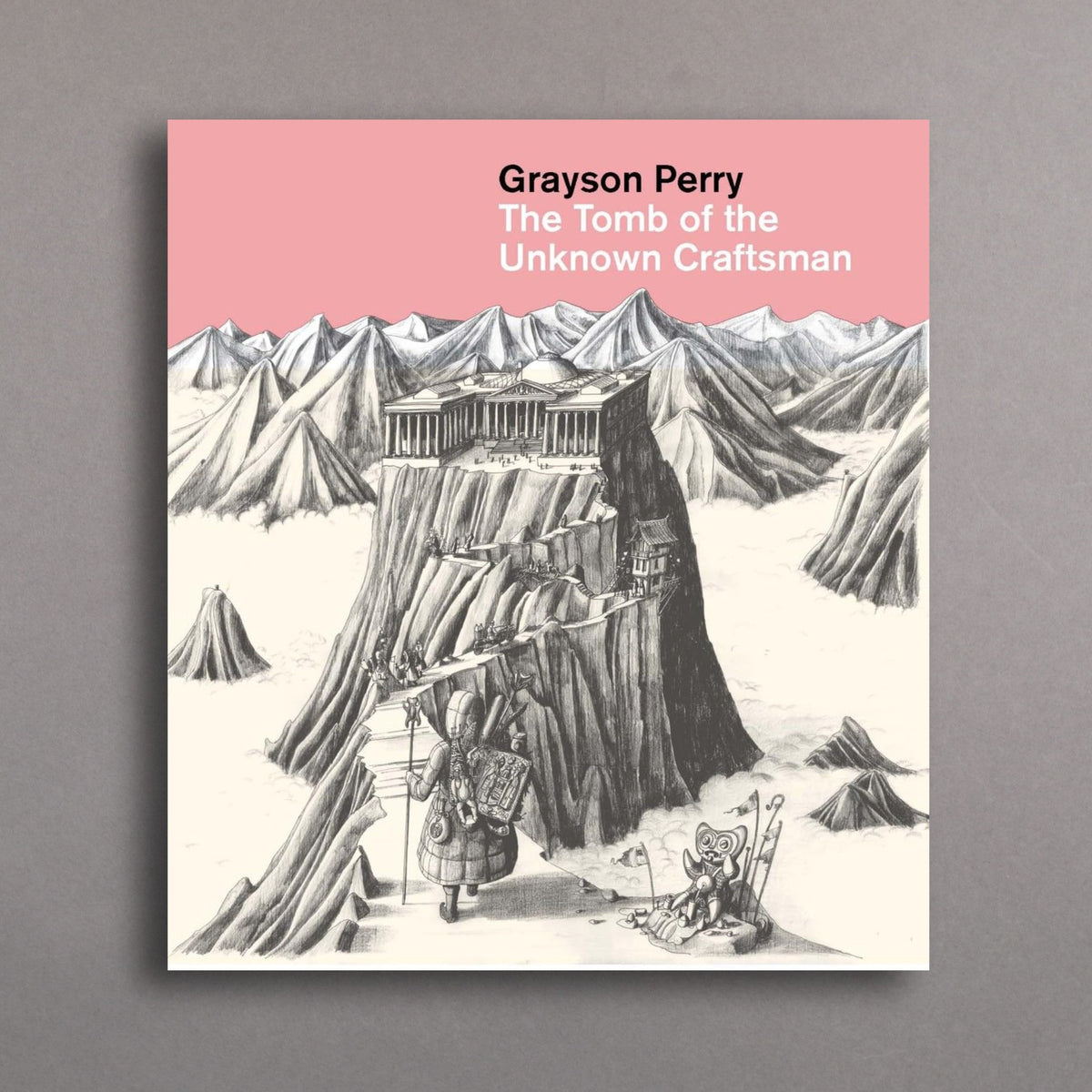Book cover of 'The Tomb of the Unknown Craftsman' by Grayson Perry with a pink background and mountain illustration.